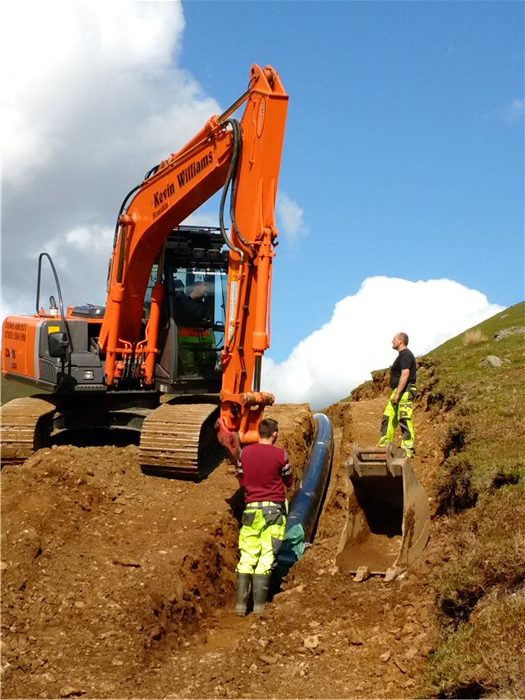 The pipe is drawn into the trench 3 June 2015 The pipe is drawn into the trench 3 June 2015