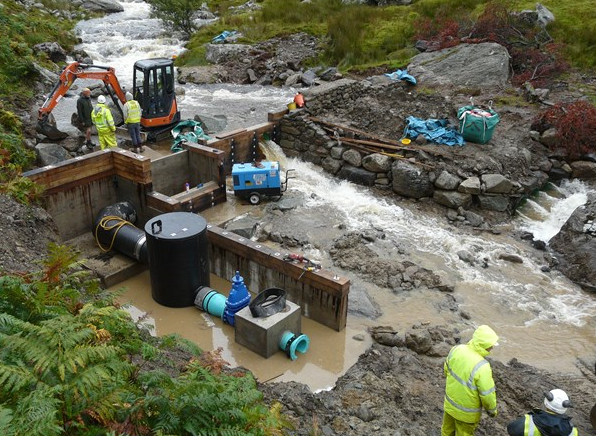 Heavy rainfall briefly overwhelms the diversionary pipes and floods the working area 2 Sept 2015