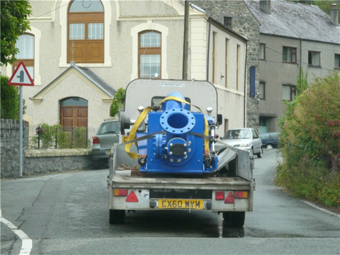 The turbine is taken through the village to the power house 29 July 2015