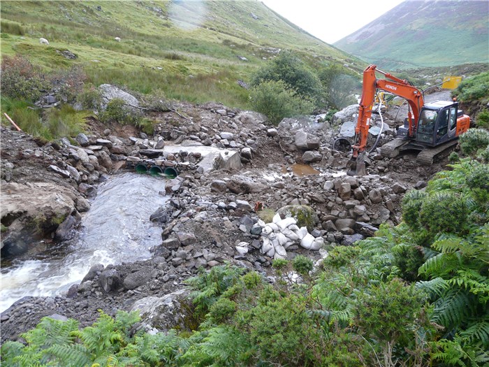 The river is diverted through the pipes on the south bank 28 July 2015