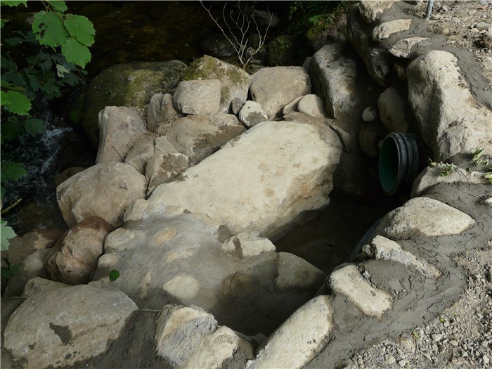 The outlet returning water from the turbine to the river nears completion 13 Aug 2015