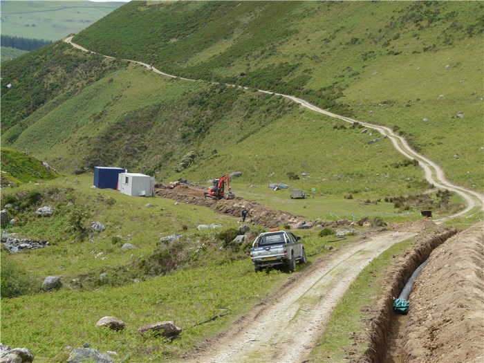 The first section of pipe is laid on the north bank of the Afon Anafon 16 June 2015