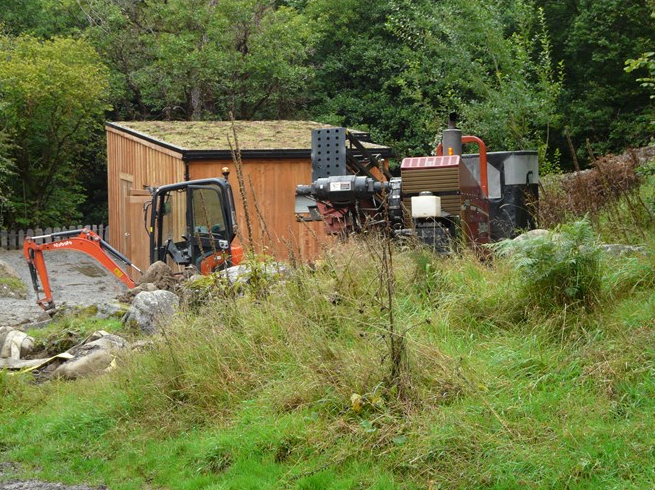 The Ditch Witch is positioned behind the turbine house 2 Sept 2015 The Ditch Witch is positioned behind the turbine house 2 Sept 2015